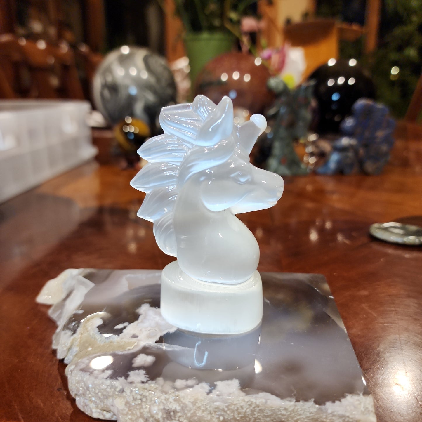 Selenite unicorn carving