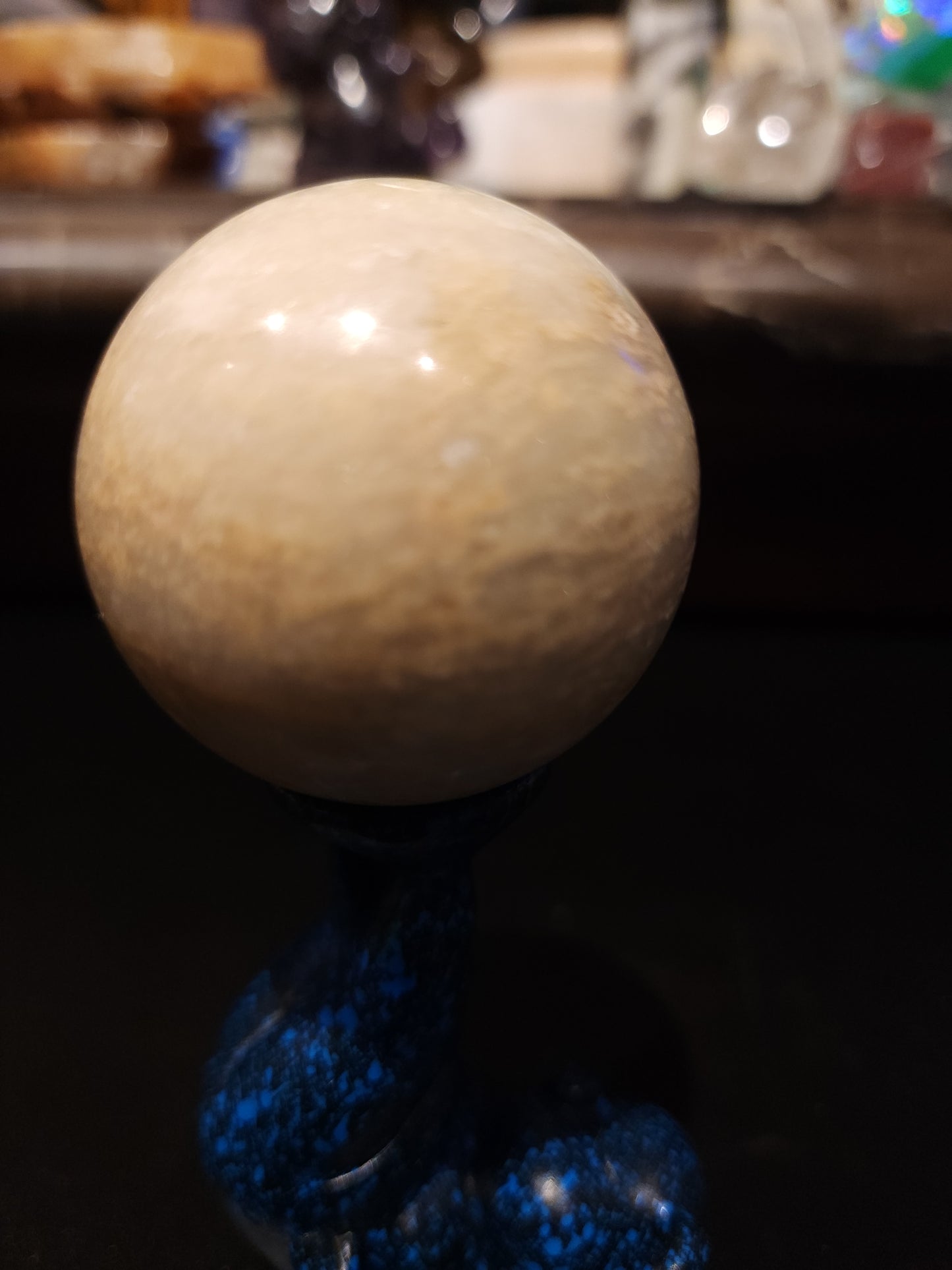 Calcite sphere with piggy sphere holder