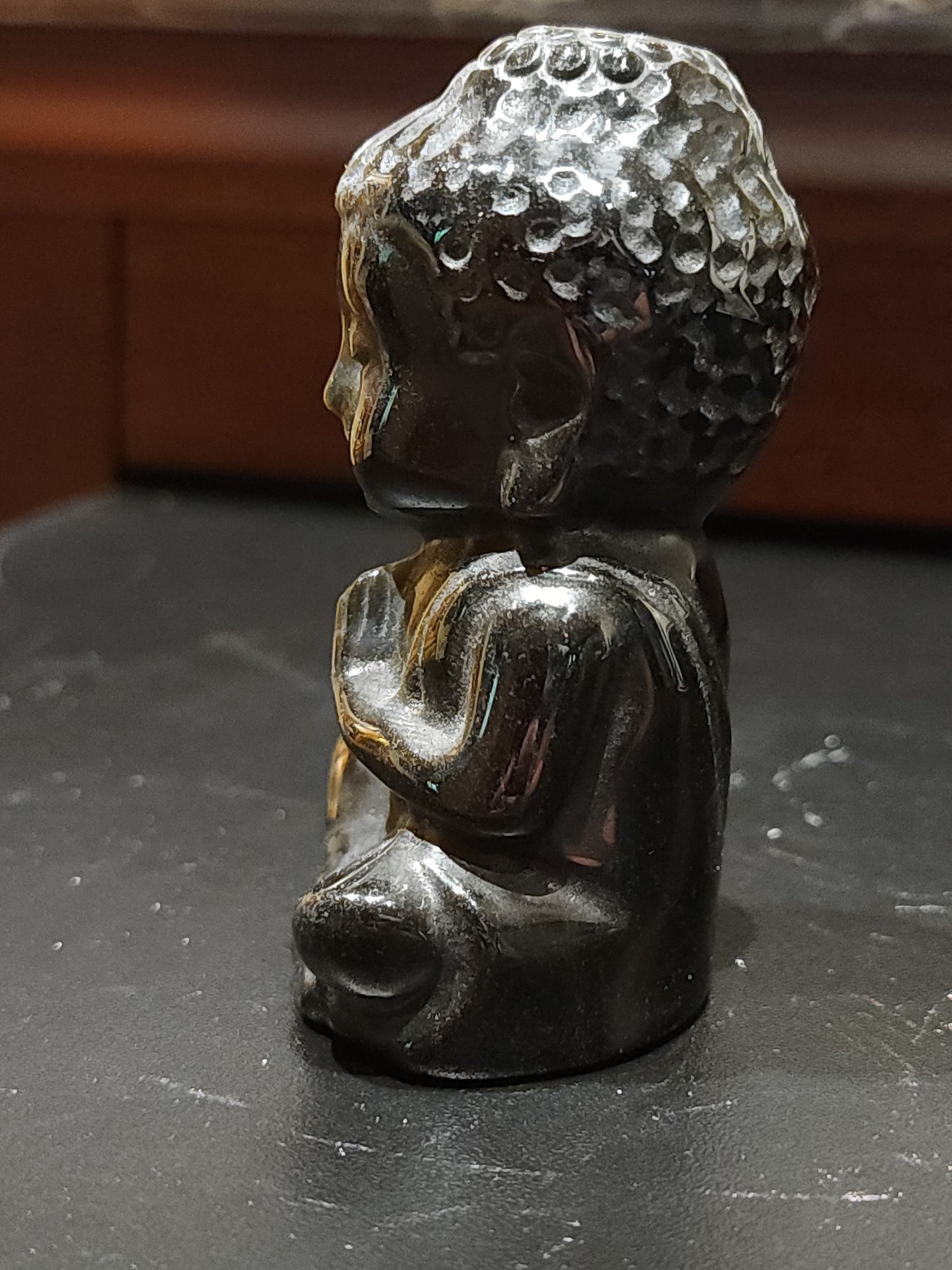 Golden obsidian buddha