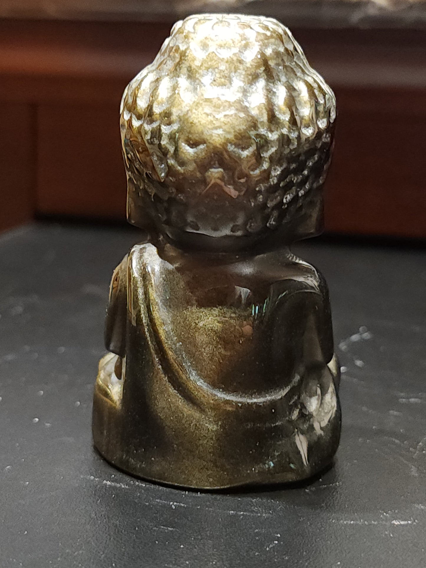 Golden obsidian buddha