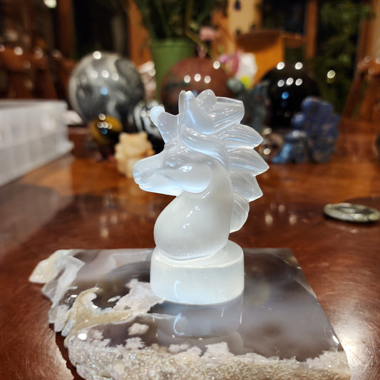 Selenite unicorn carving